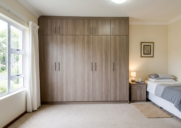Built-in wardrobe with cabinets and hanging storage